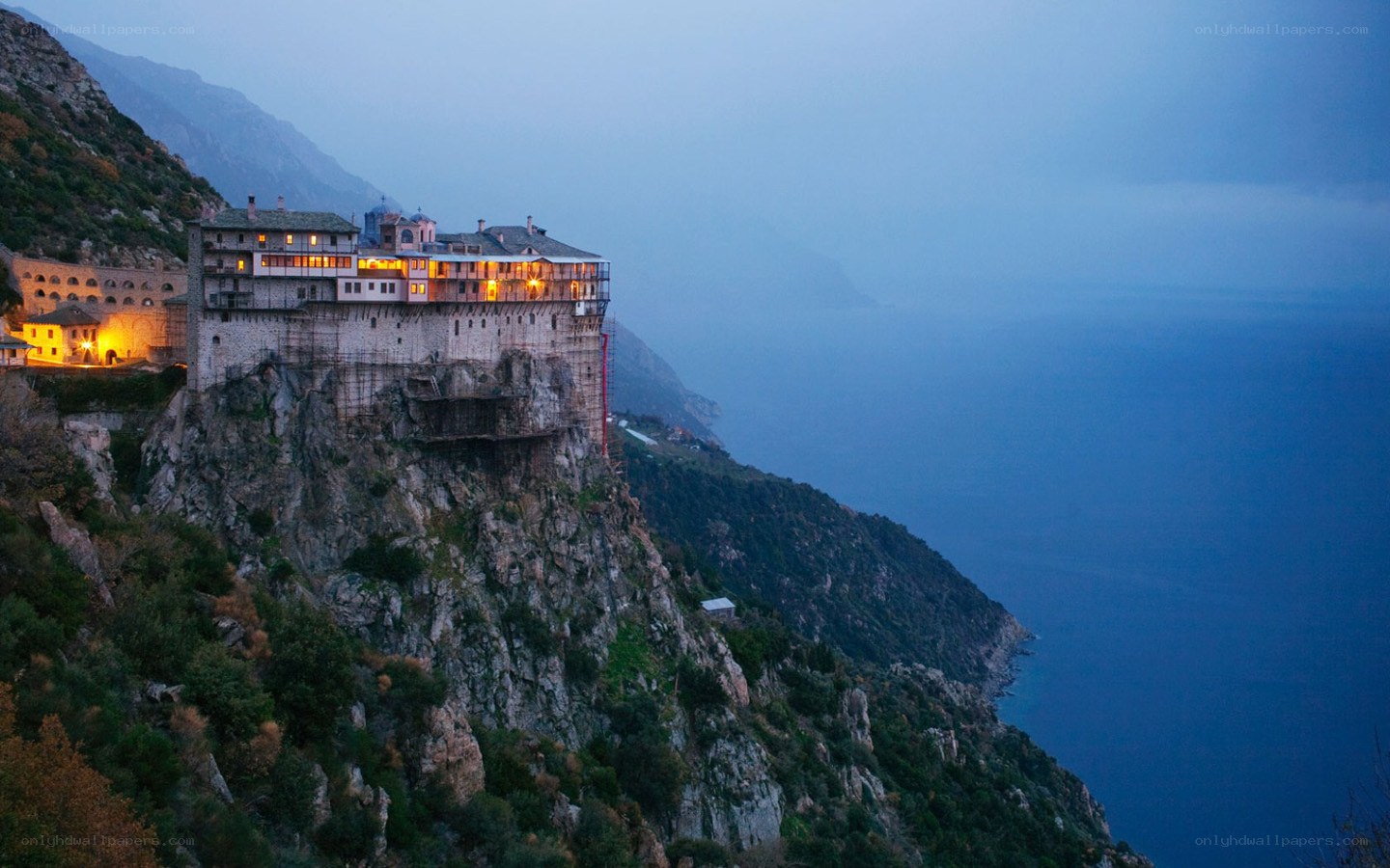 Monastery on a cliff at dusk