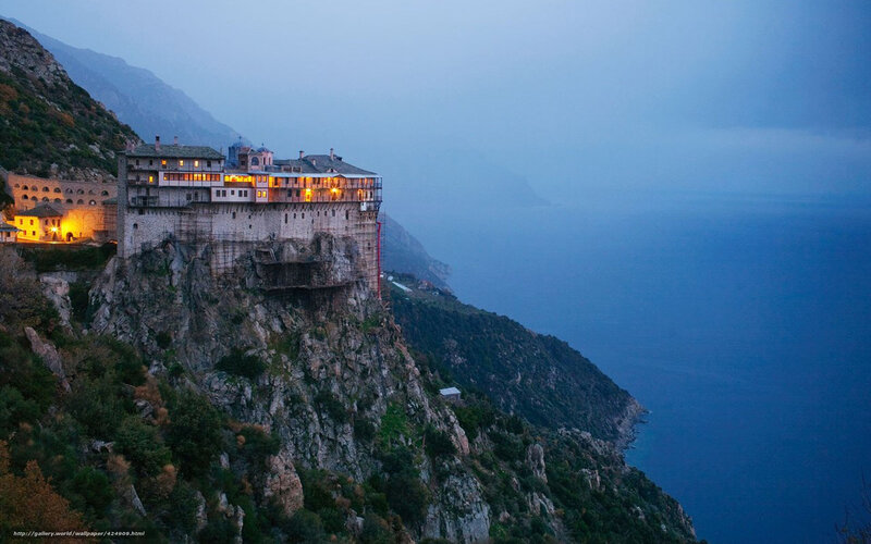 Monastery on a cliff at dusk