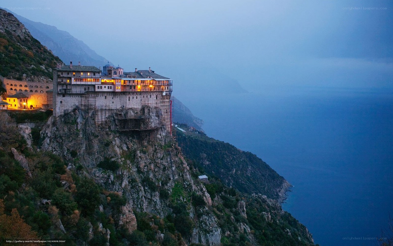 Monastery on a cliff at dusk