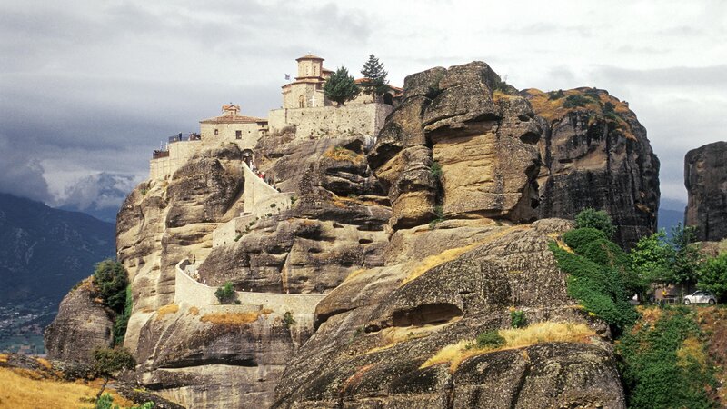 Monastery on Rock Formation — Brown, Dramatic