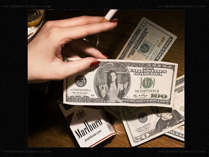 money and cigarettes on table