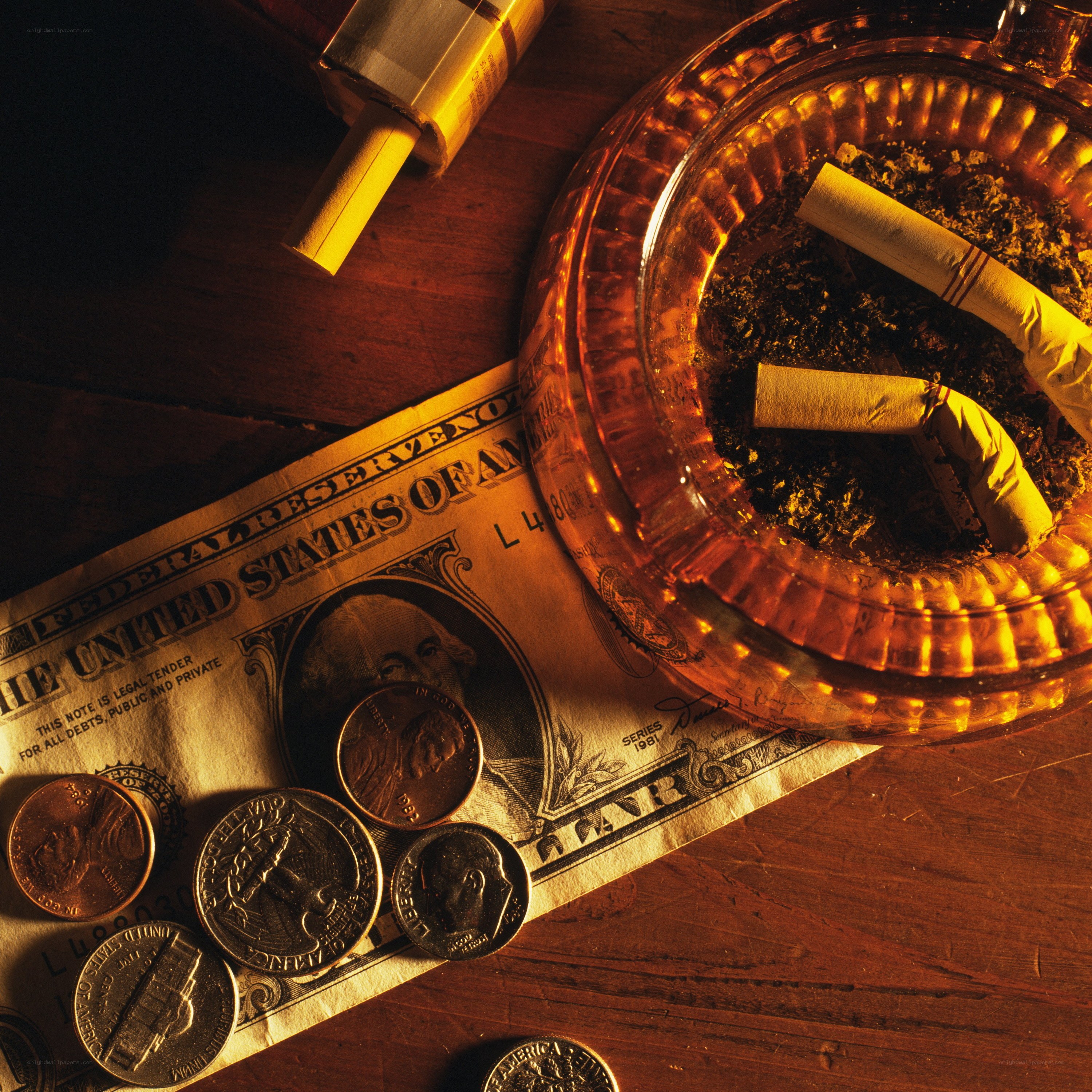 money and cigarettes on table