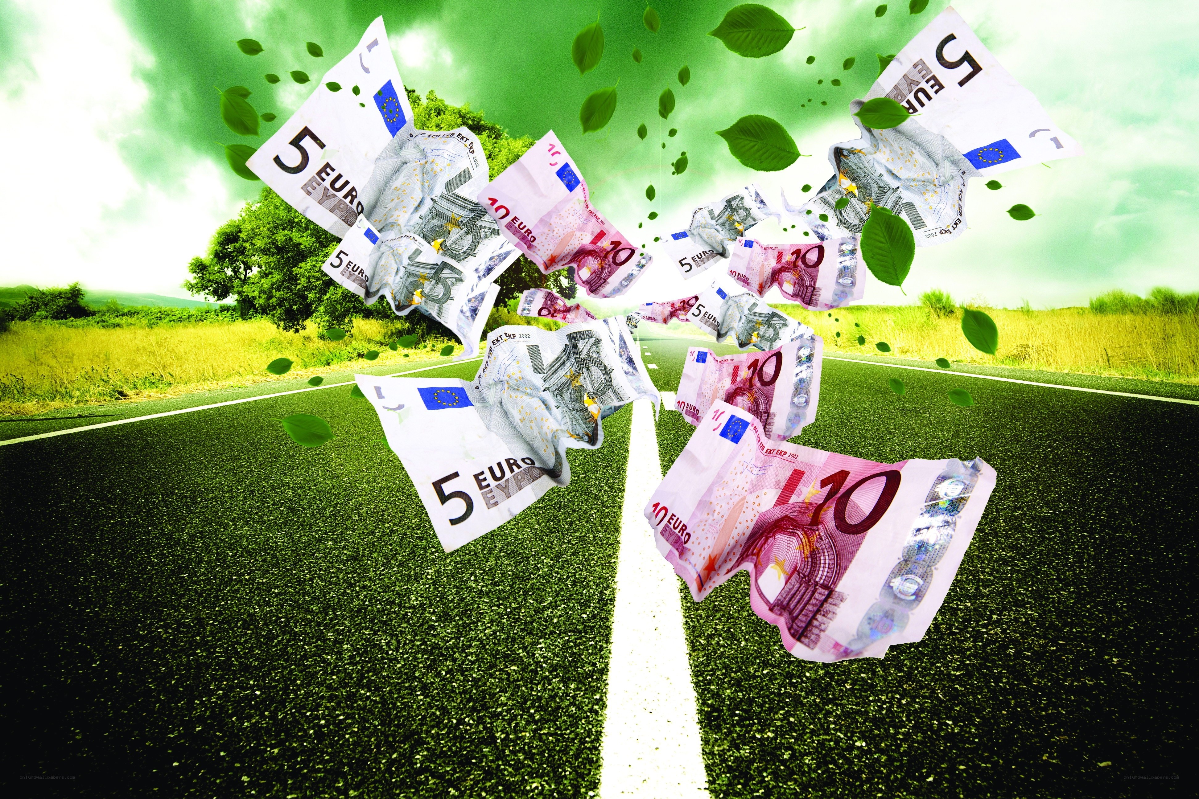 Money flying on a road
