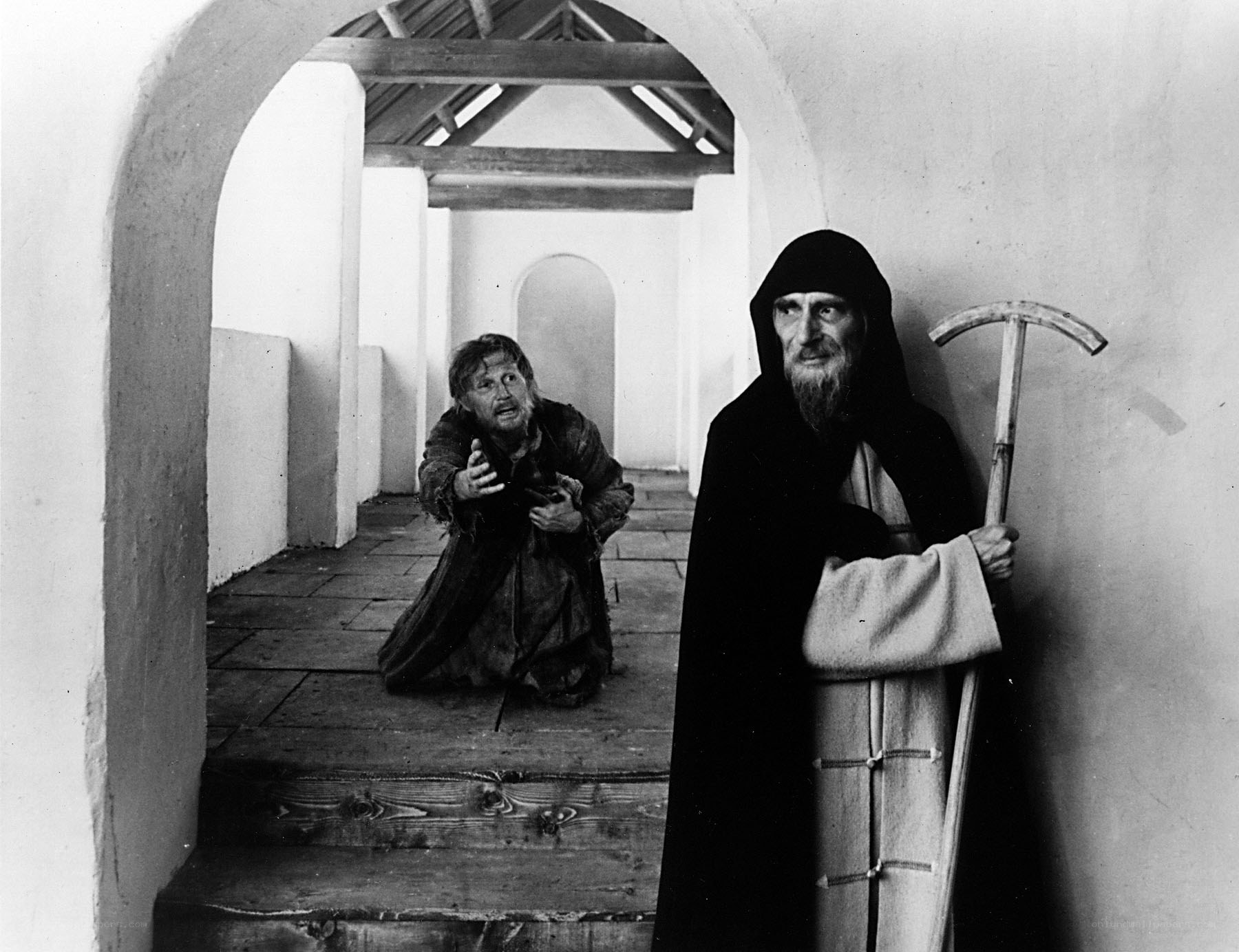 Monk and beggar in corridor