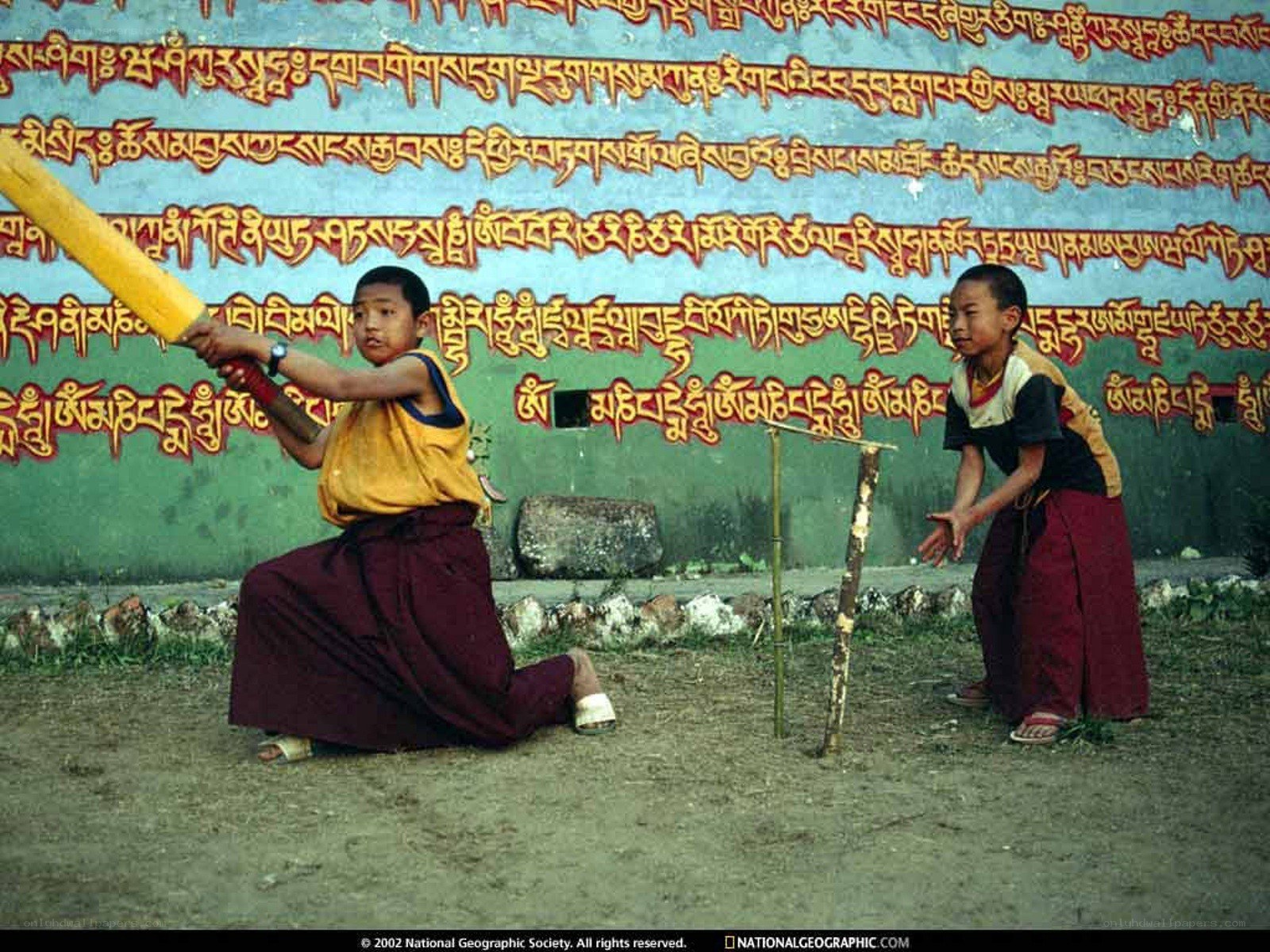 Monk boys playing cricket