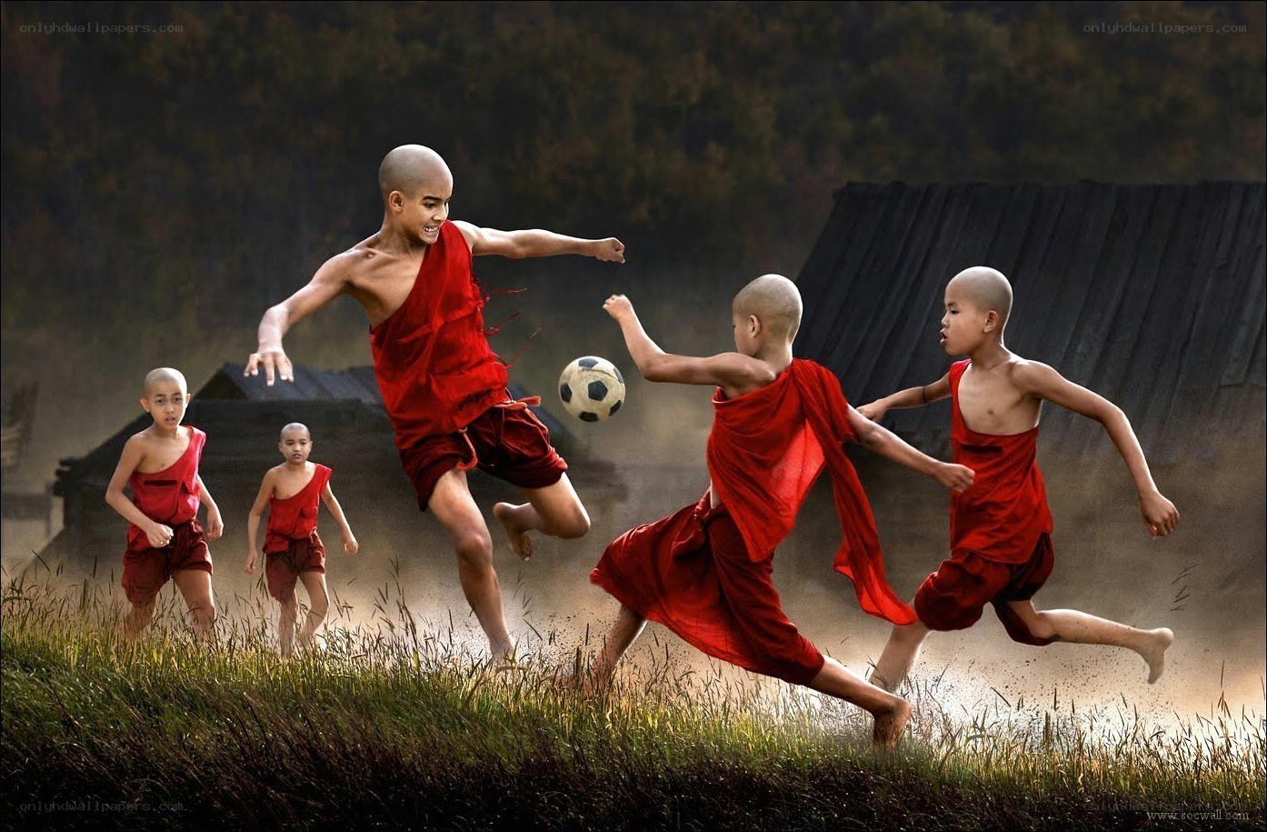 Monk boys playing soccer