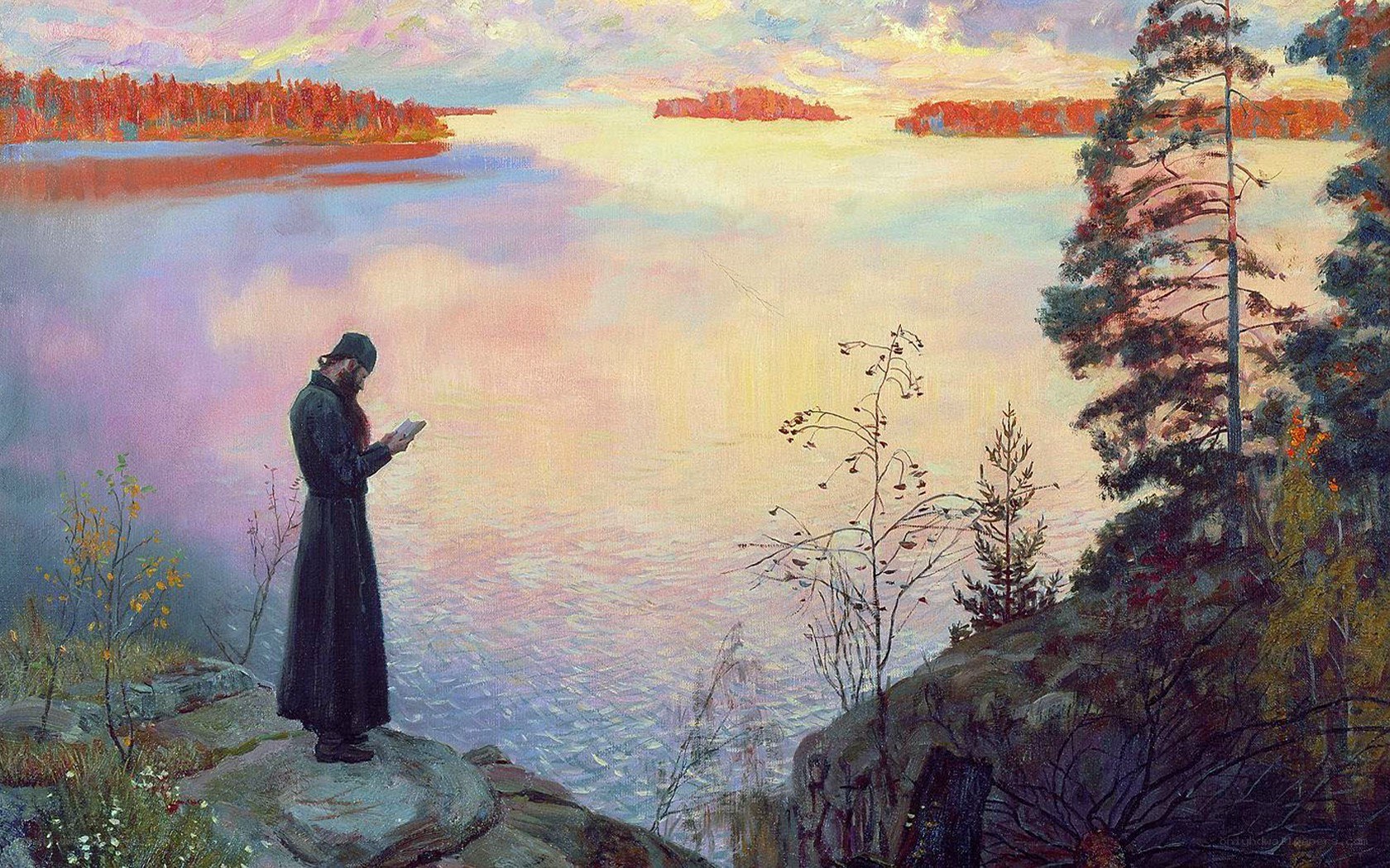 Monk by the lake at sunset