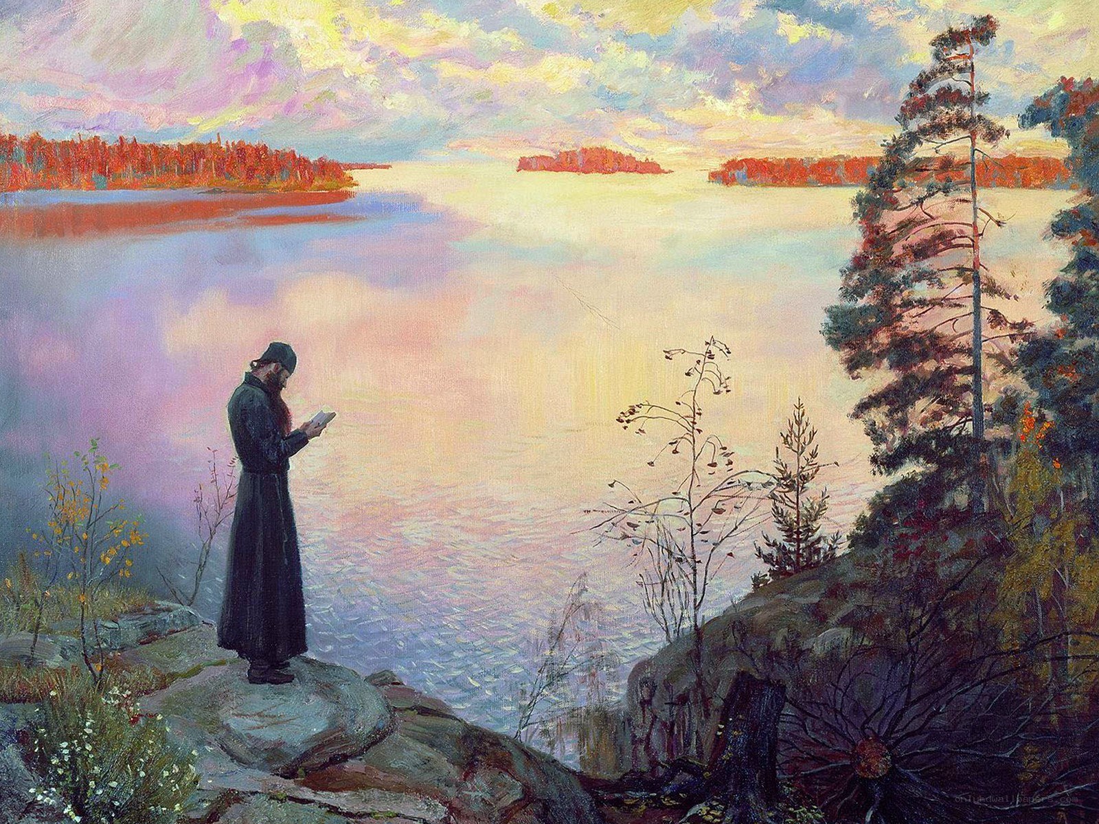 Monk by the lake at sunset