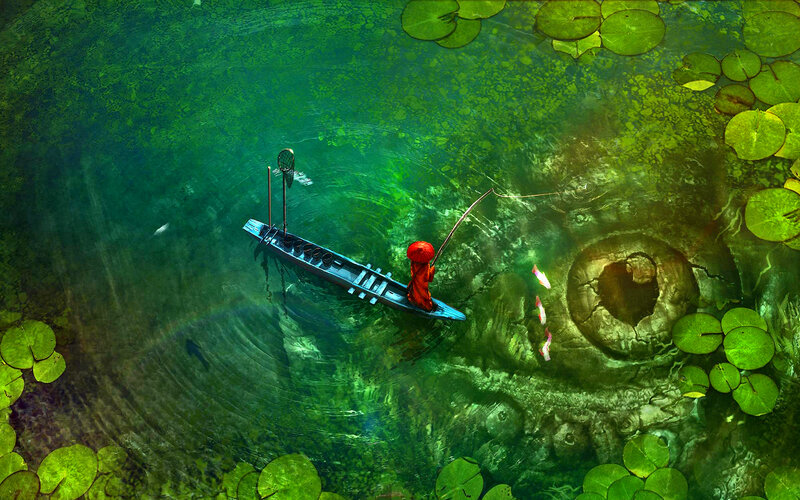 Monk Fishing in Pond