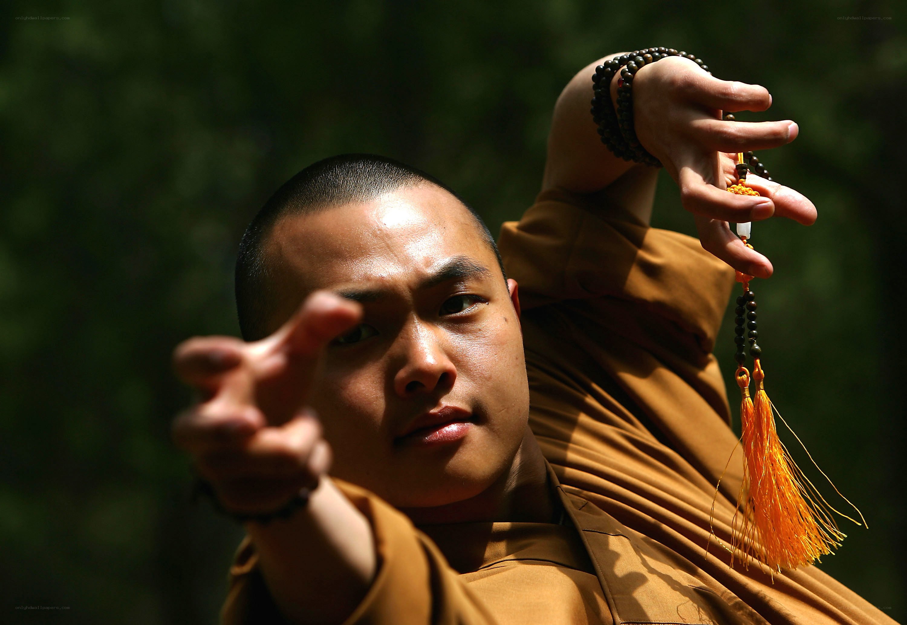 monk holding prayer beads