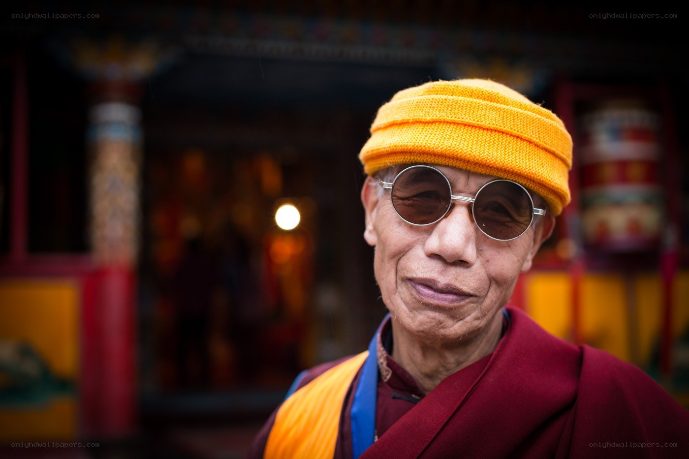 Monk in sunglasses and hat