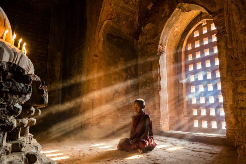 Monk Meditating in Temple — Brown