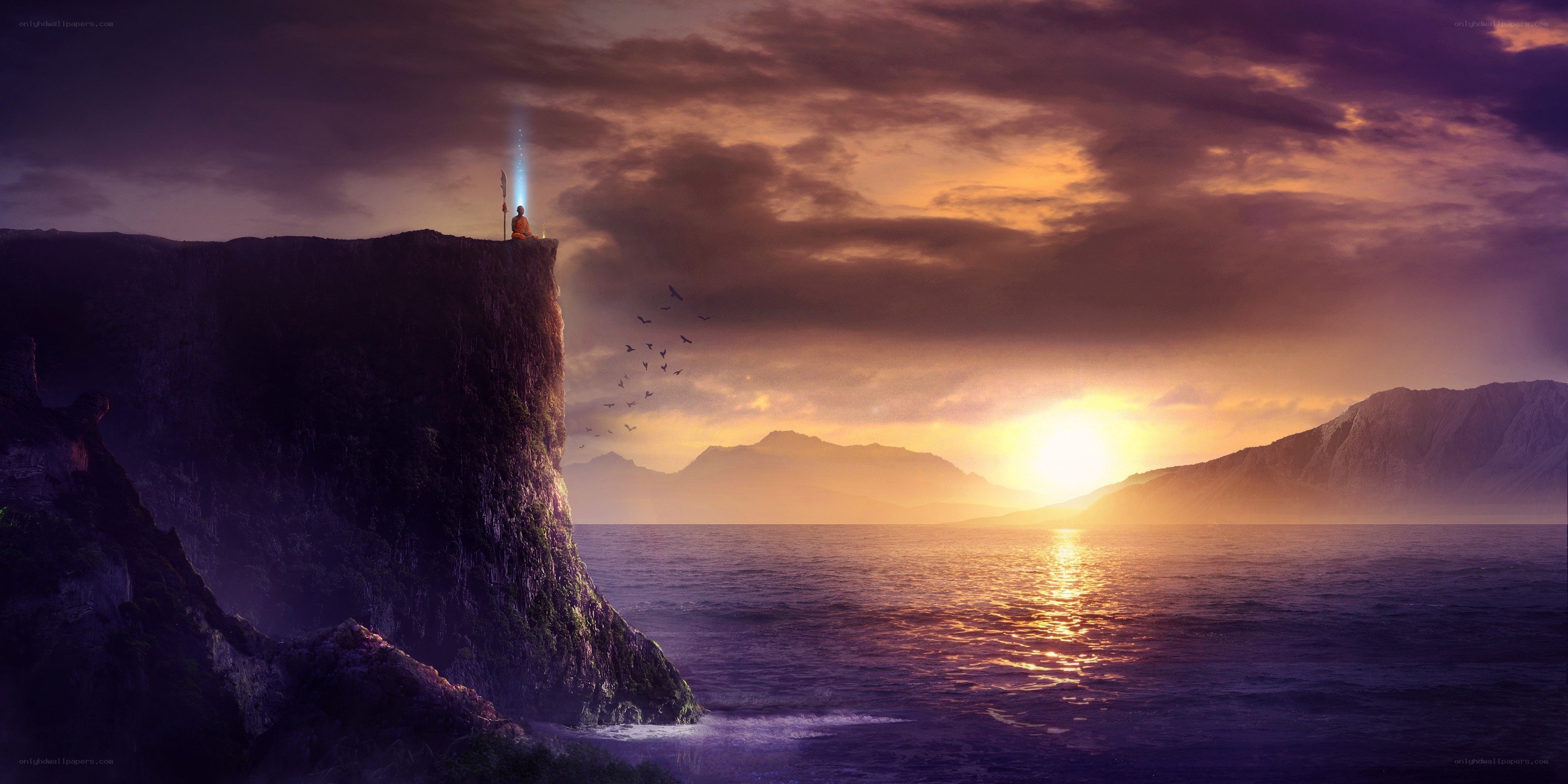 Monk on a cliff at sunset