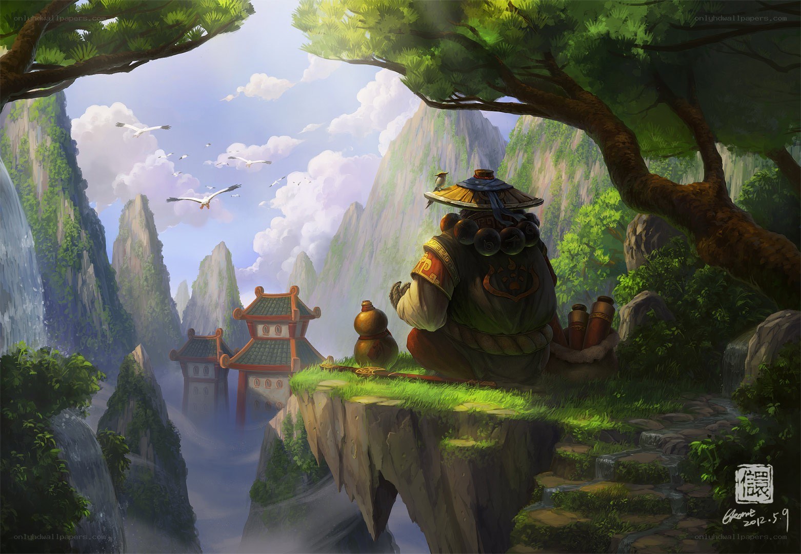Monk on a cliff overlooking mountains