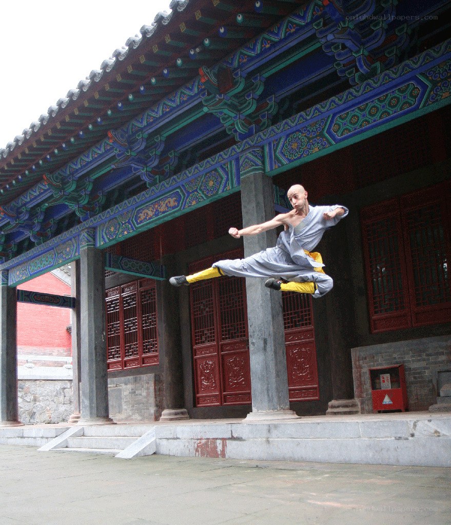 Monk performing martial arts jump