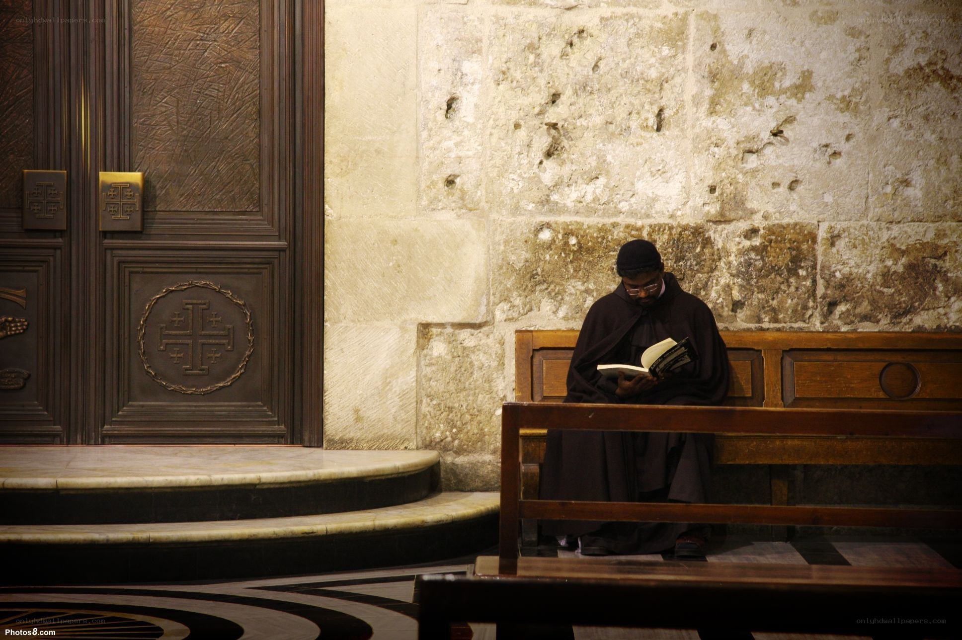 Monk reading in a church