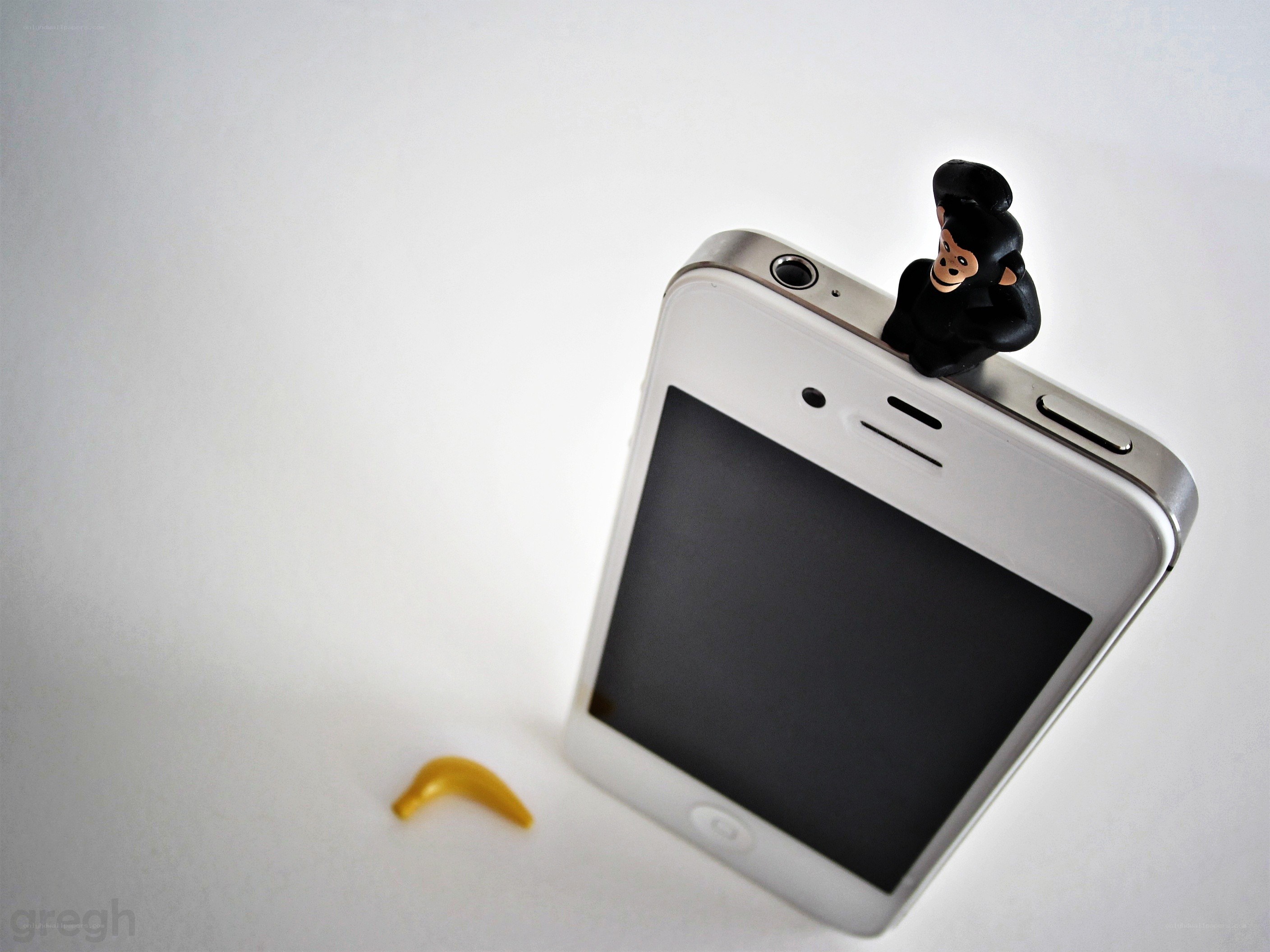 Monkey figurine on phone