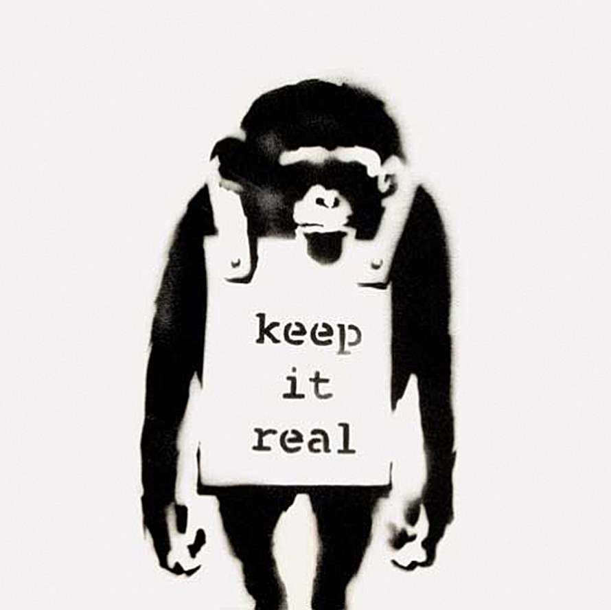 monkey holding sign