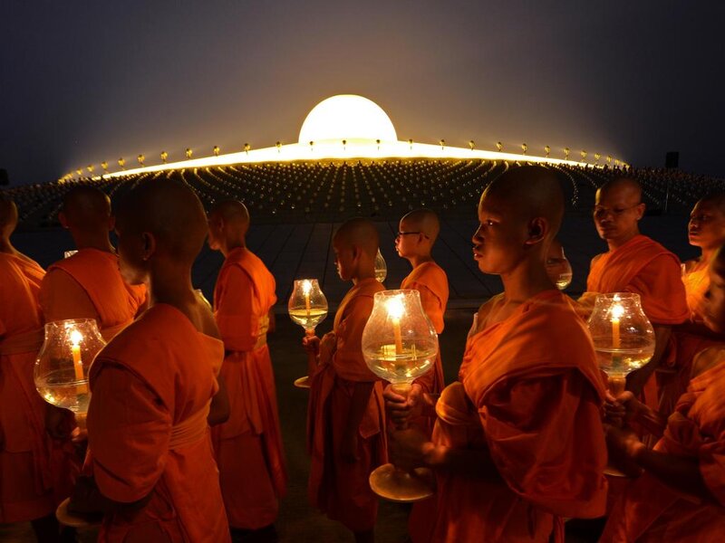 Monks Holding Lanterns