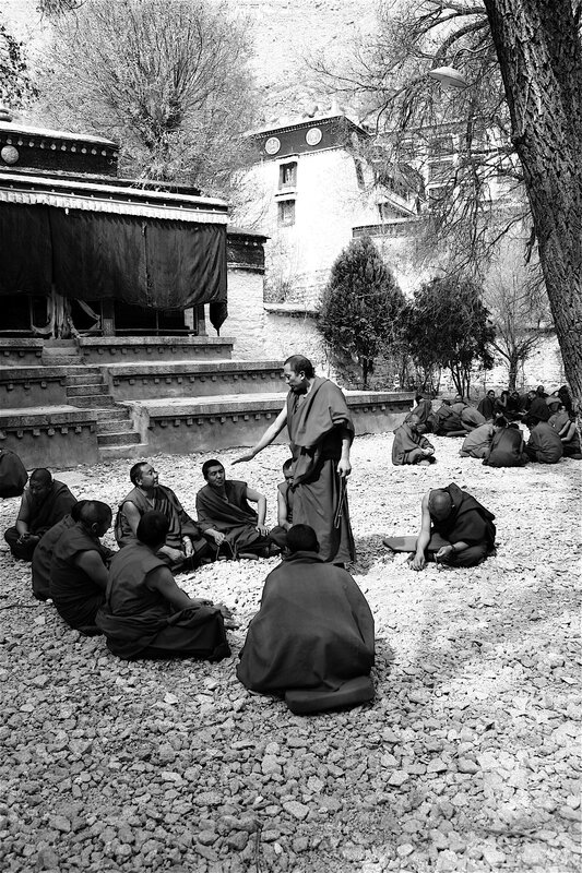 Monks in a courtyard