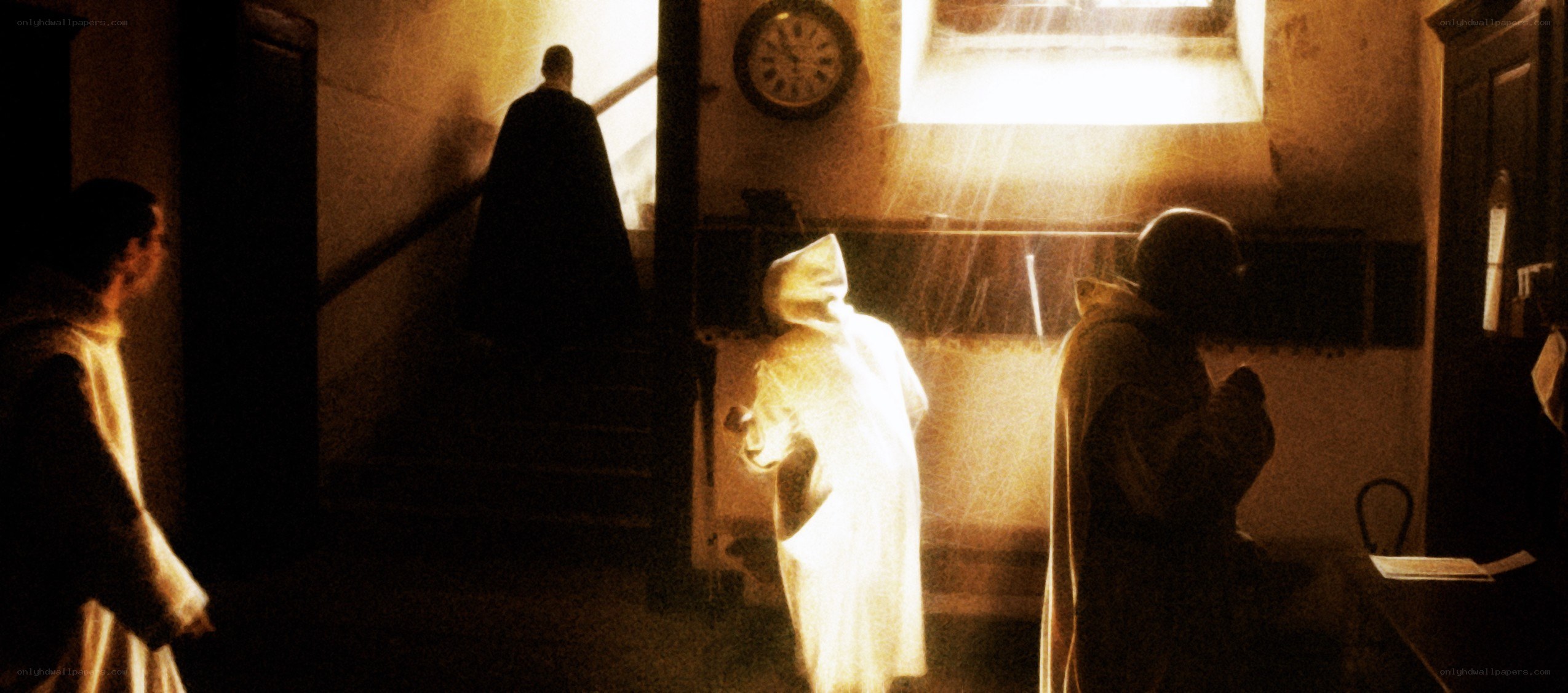 Monks in a dimly lit hallway