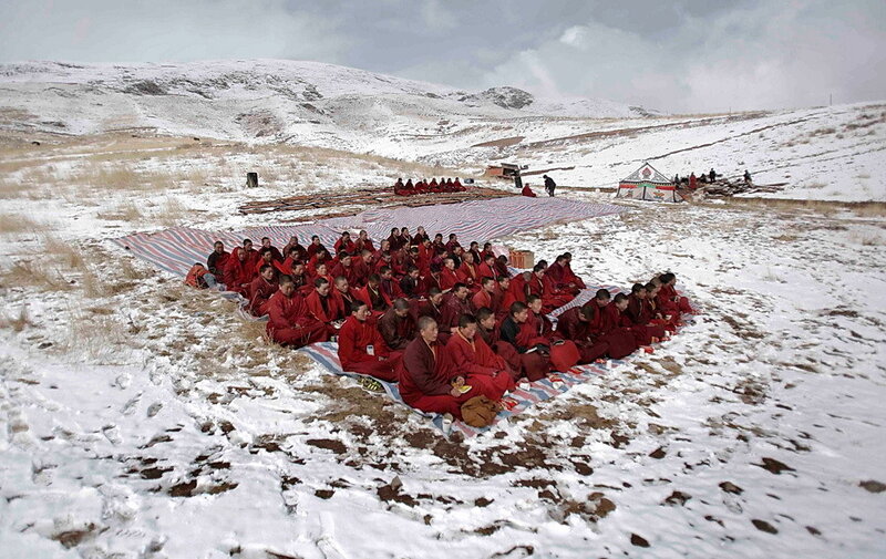 Monks in snowy landscape