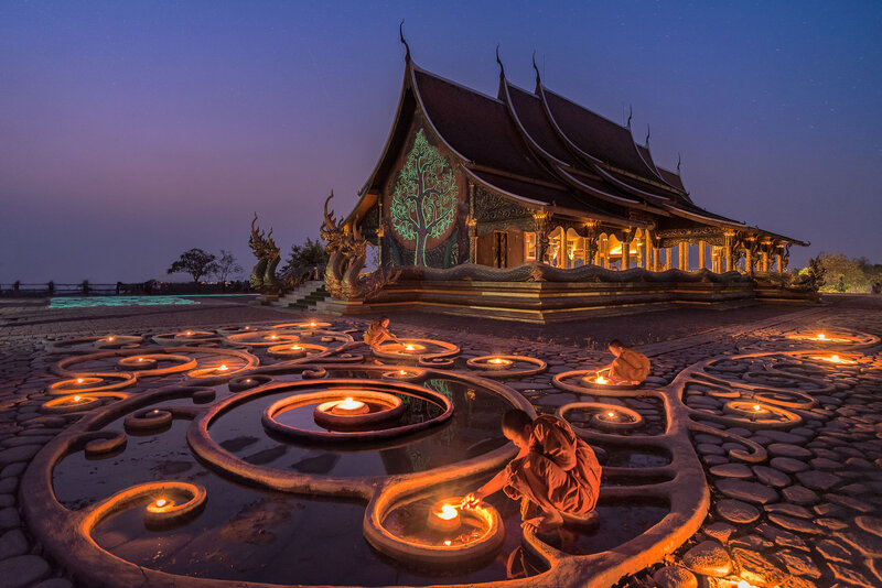 Monks Lighting Candles