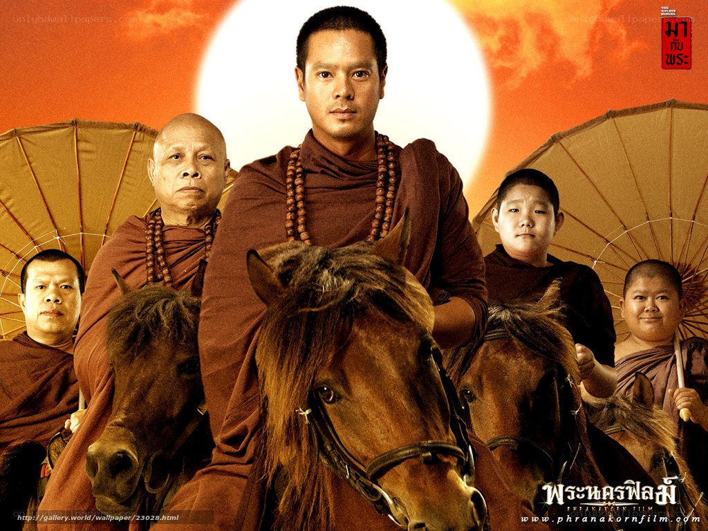 Monks on horseback at sunset