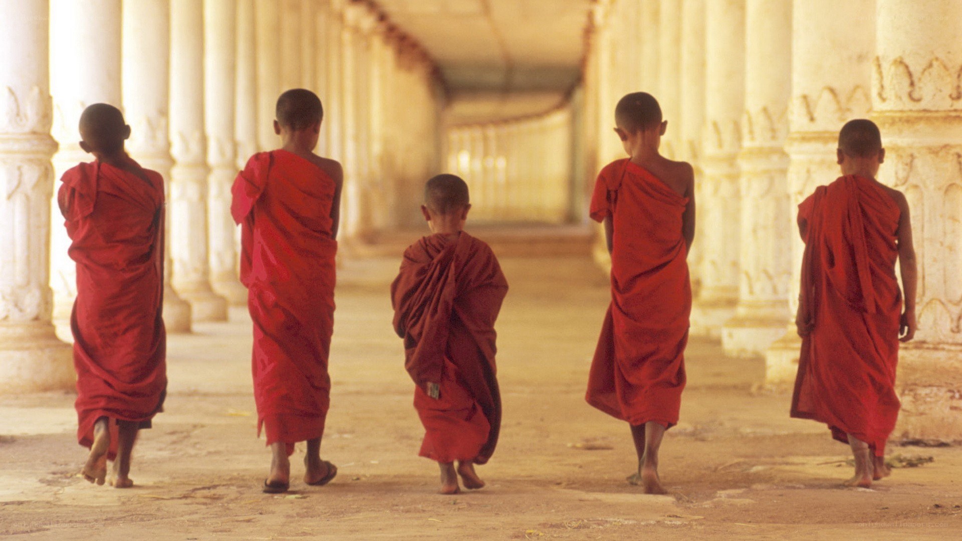 Monks walking in a temple corridor