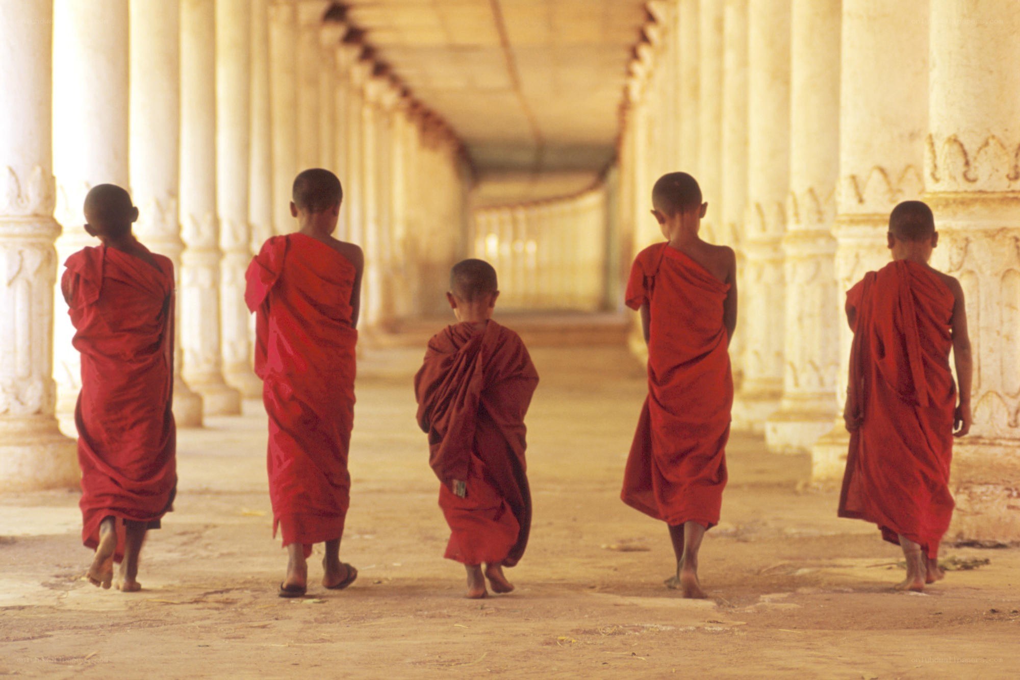 Monks walking in a temple corridor