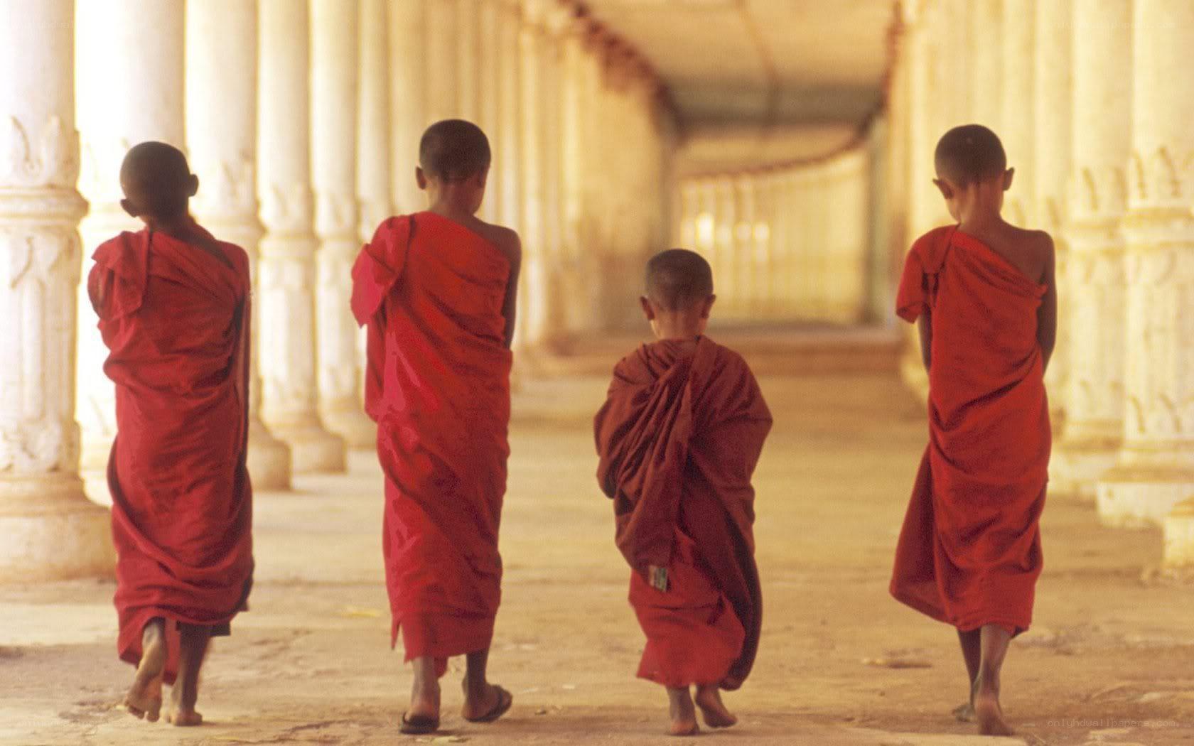 Monks walking in a temple corridor