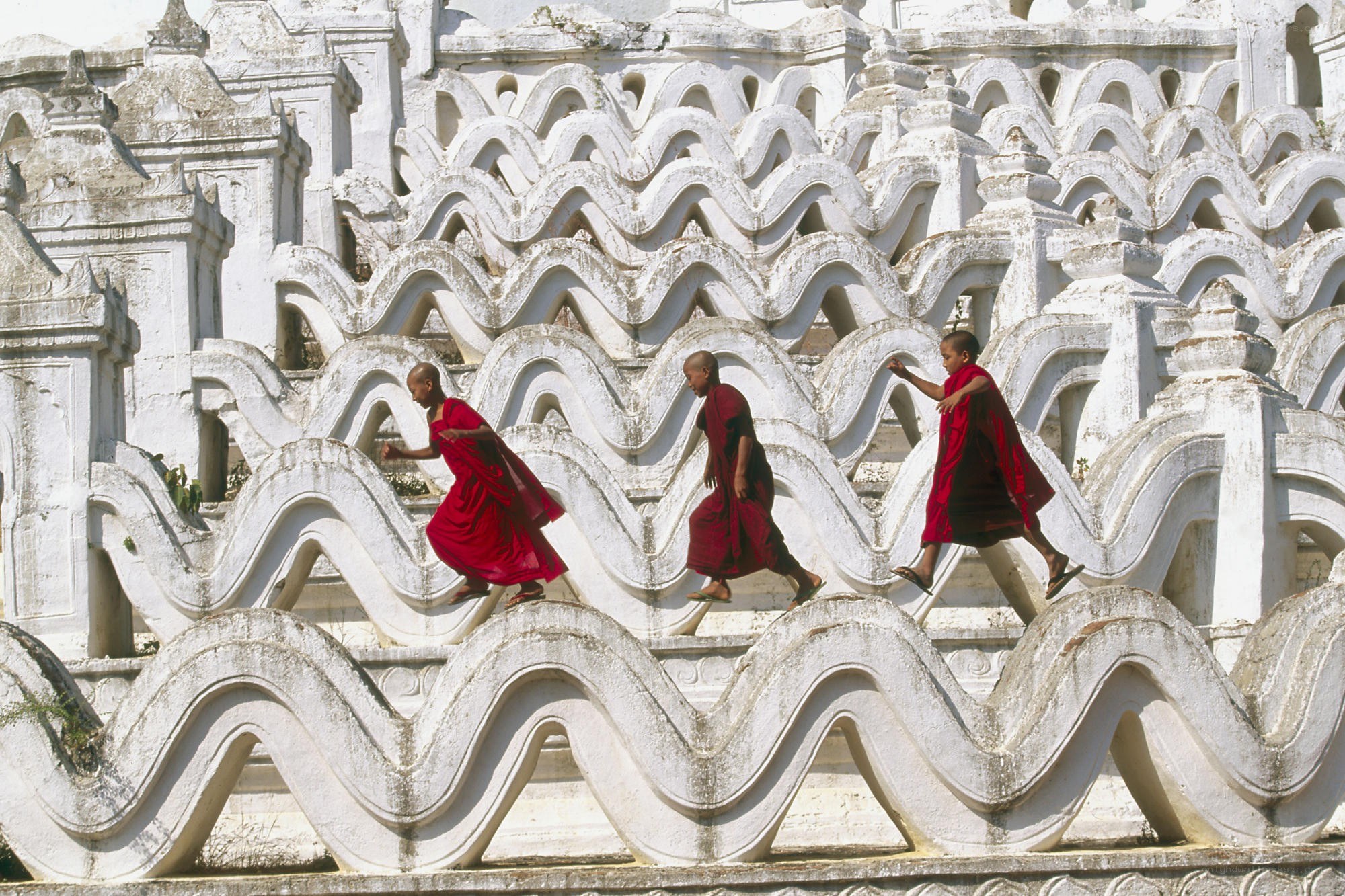 Monks walking on temple stairs