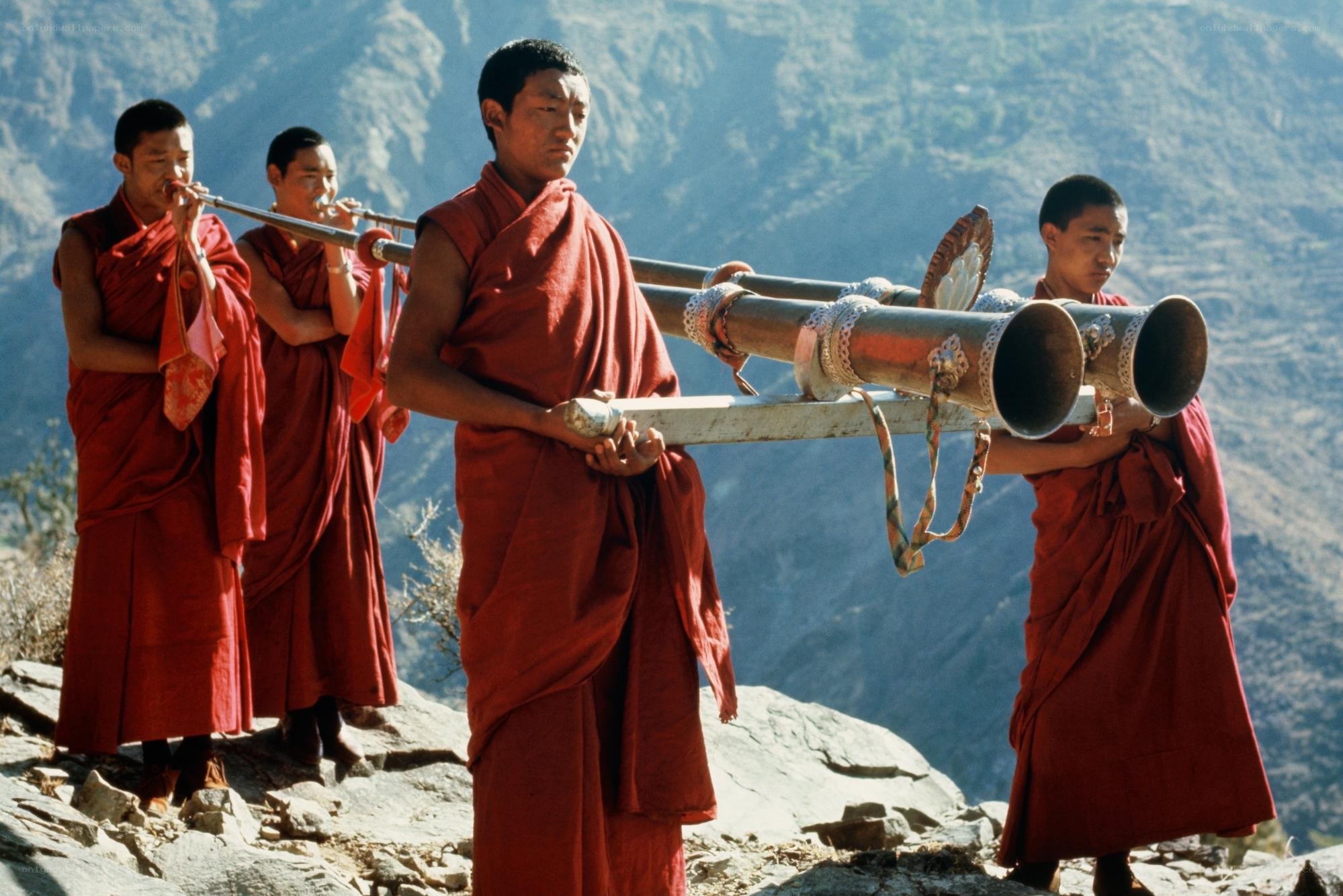 Monks with ceremonial horns