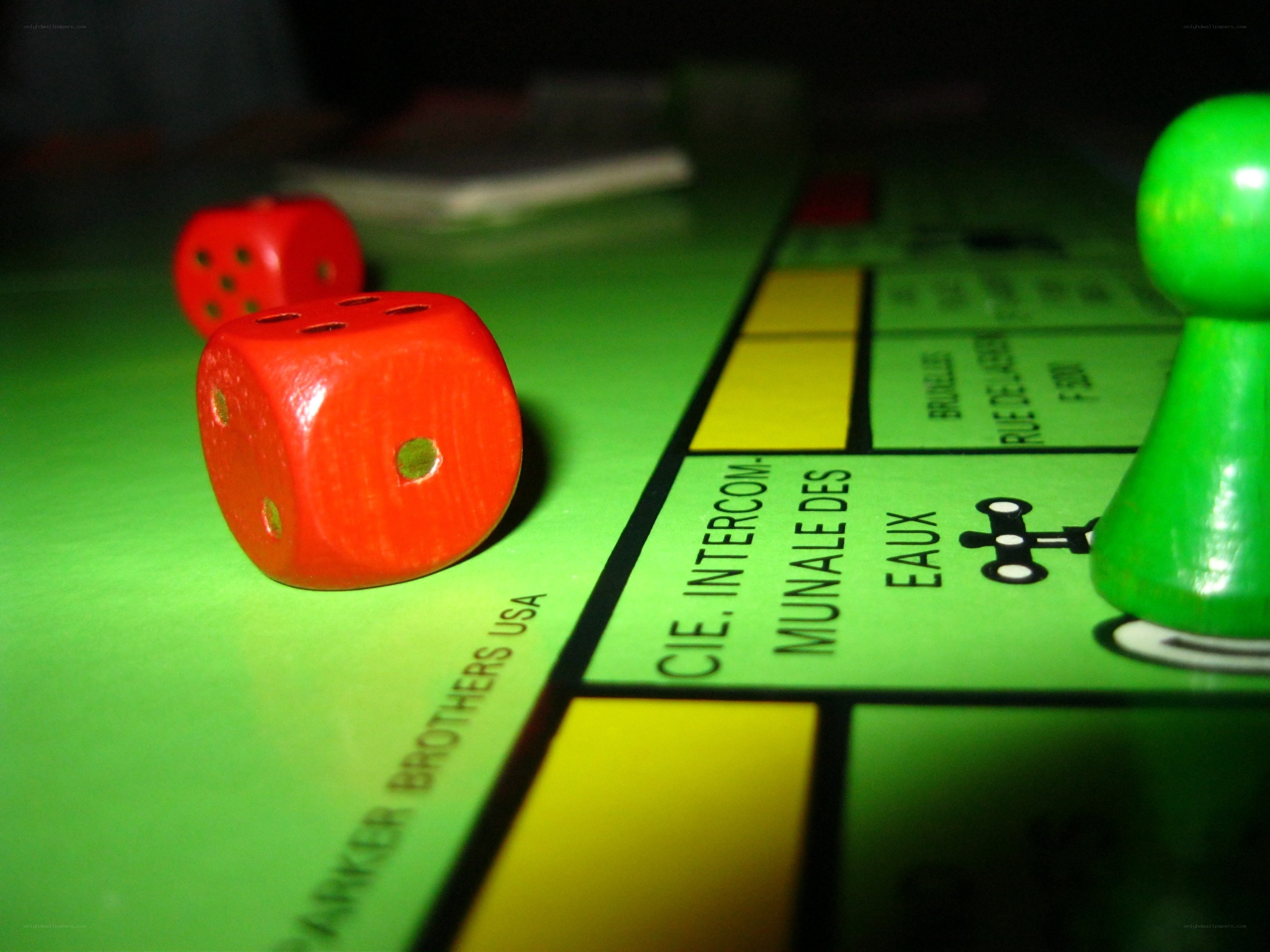 Monopoly game with dice and pawn