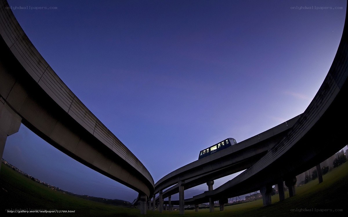 Monorail at dusk on curved tracks