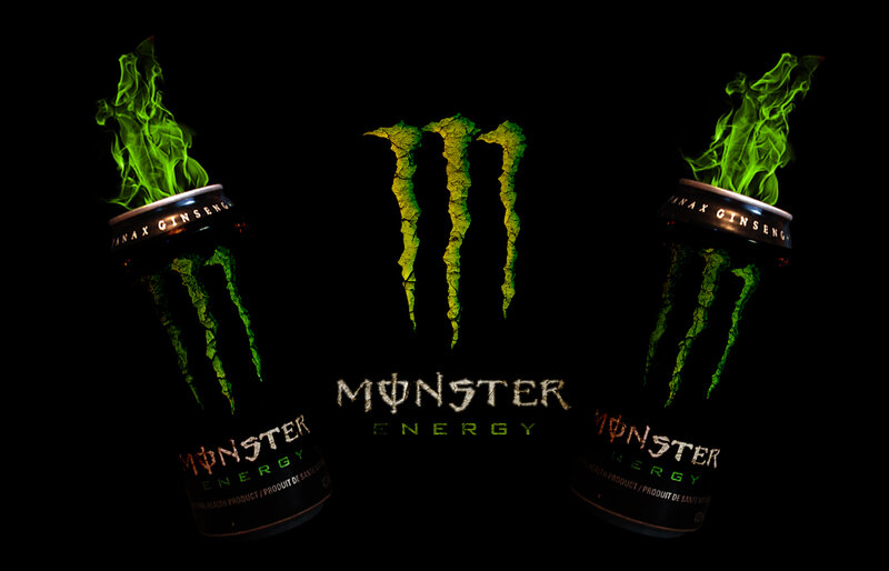 Monster Energy cans with green flames