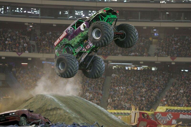 Monster truck jumping over car