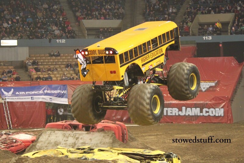 Monster truck jumping over cars