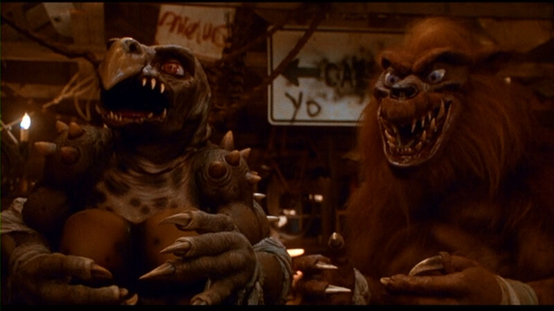 monsters in a dimly lit room