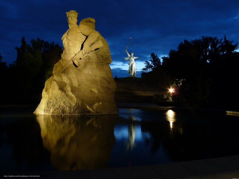 Monument at dusk with statues