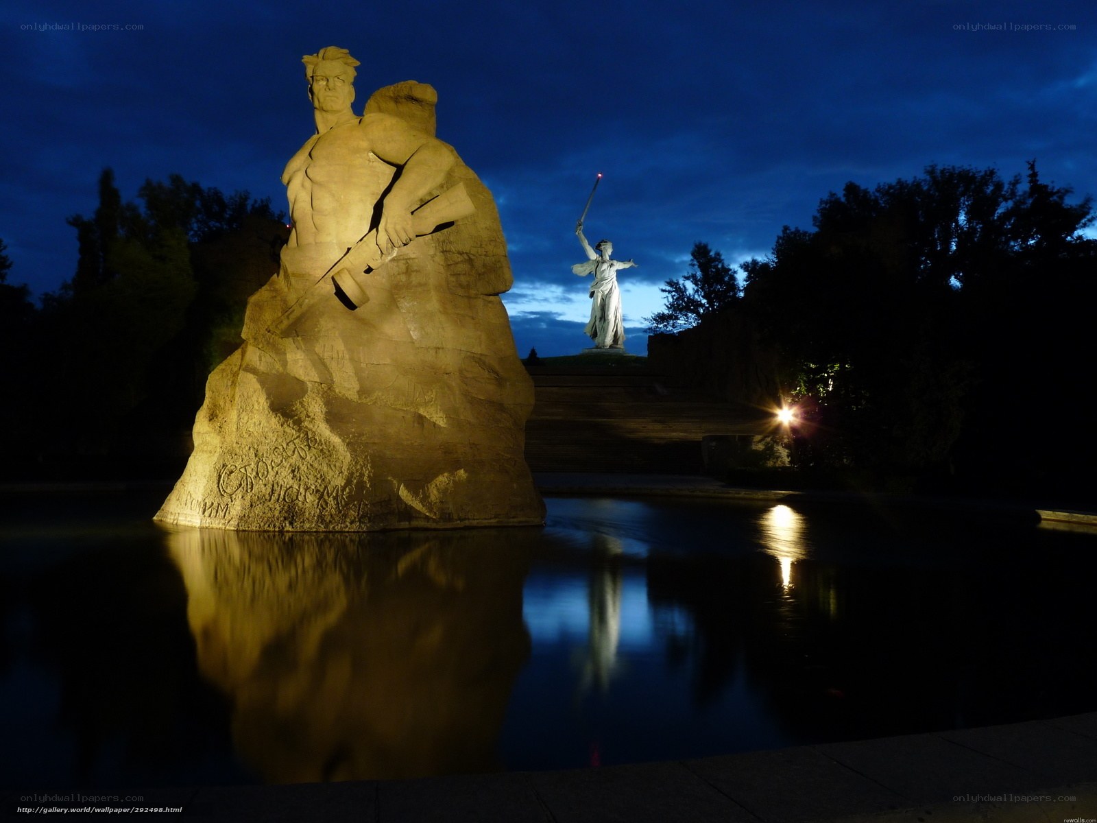 Monument at dusk with statues