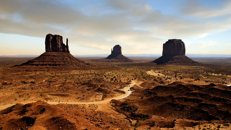 Monument Valley Rock Formations — Brown, Serene, Afternoon, Photograph, Dirt Road