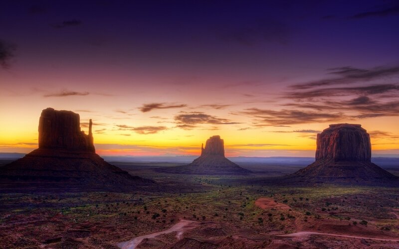 Monument Valley Rock Formations — Purple, Dramatic, Sunset
