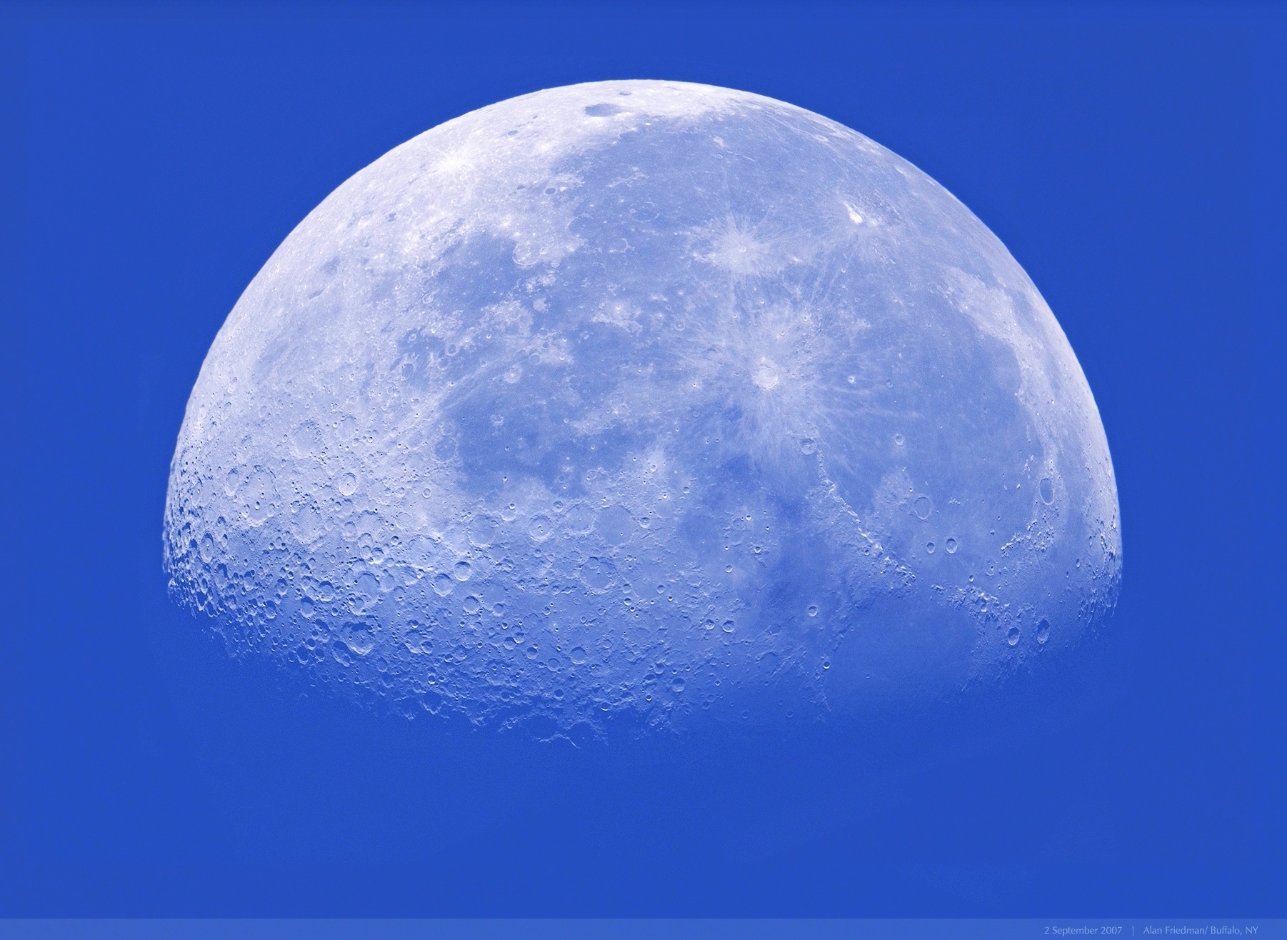 Moon against blue sky