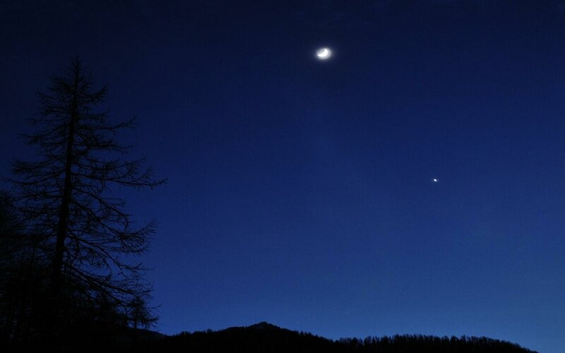 Moon and planet in night sky