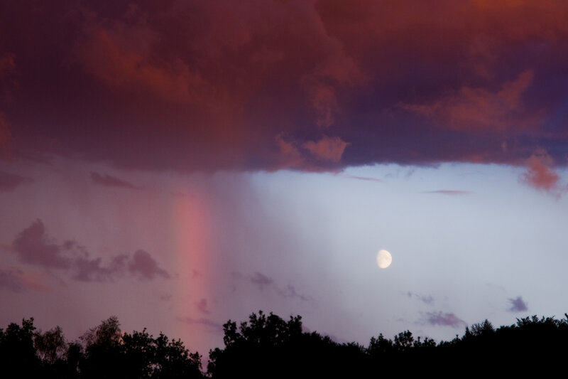 Moon and Rainbow in Sky