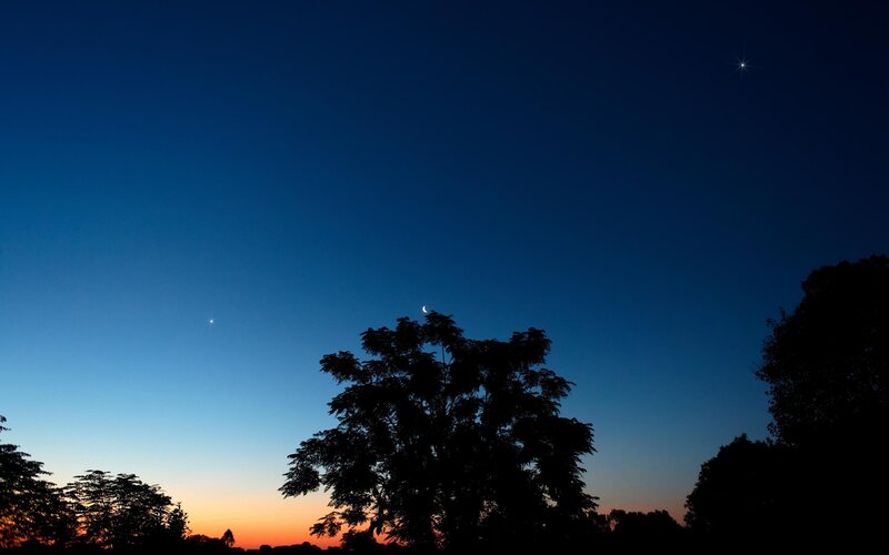 Moon and stars at dusk