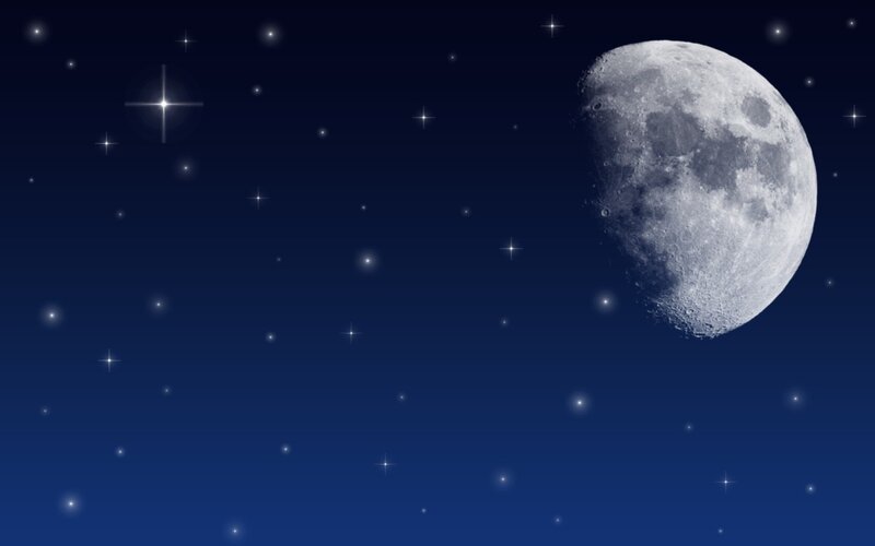 Moon and stars in night sky