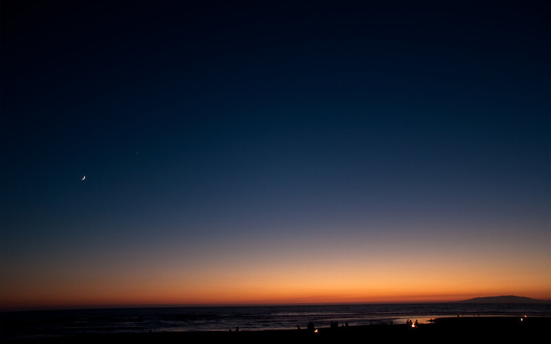 Moon and stars over beach