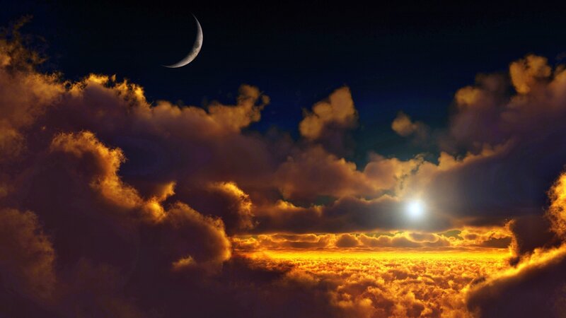 Moon and sun over clouds